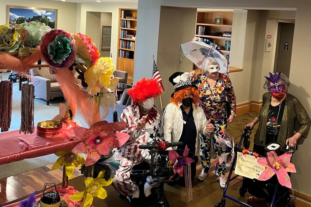 Residents Dressed Up During a Lively Mardi Gras Parade at All Seasons Rochester Hills in Rochester Hills, Michigan