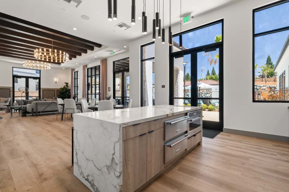 Luxury Kitchen Area with granite island countertop and pendant lights at Broadstone Villas in Folsom, California