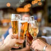 Residents enjoying their drinks near Roosevelt Park Apartments in San Jose, California