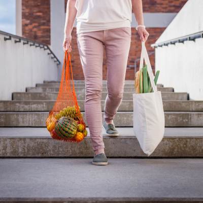 Resident carrying groceries near Sullivan's Ridge in Portland, Oregon