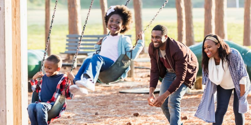 a family playing at a park ear Foxville Gardens in Sabillasville, Maryland