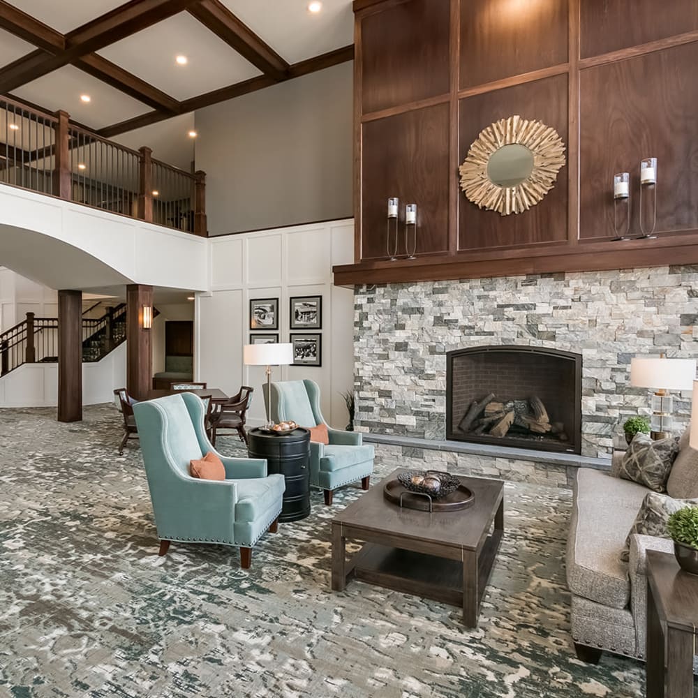 Lobby with a fireplace at Applewood Pointe Lake Elmo/Woodbury in Lake Elmo, Minnesota.