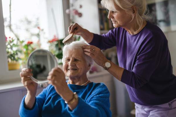  Resident getting her hair done  at O'Fallon in O'Fallon, MO