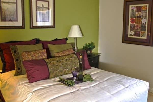 A master bedroom at Lantana Apartments with lots of natural light.