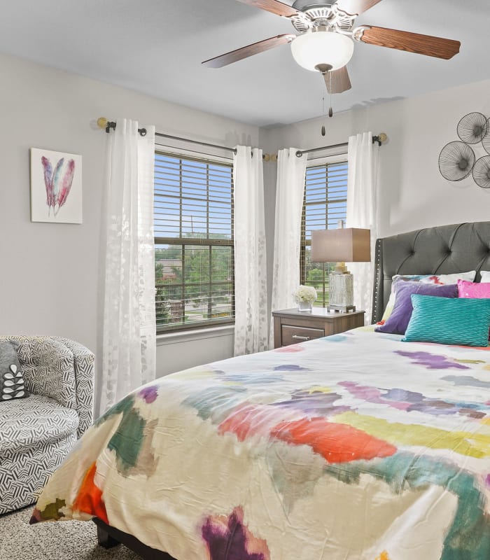 Spacious carpeted bedroom at Portofino Apartments in Wichita, Kansas