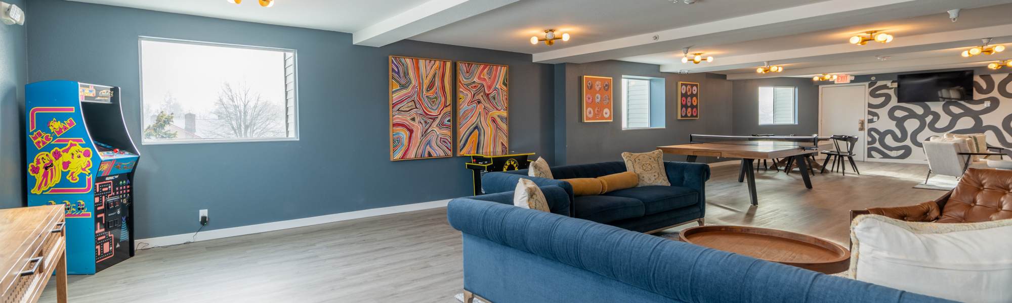 Residents club lounge with games of Thea Apartments in Tacoma, Washington
