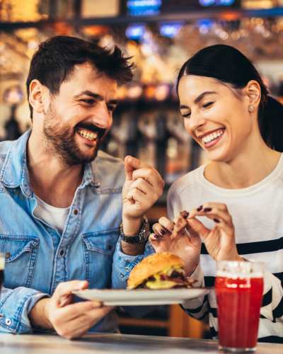 Resident couple sharing their meal at a local restaurant near The Fowler in Boise, Idaho