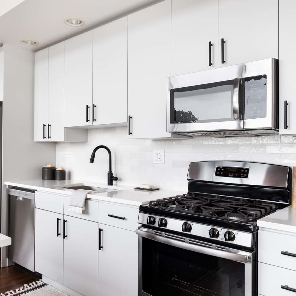Kitchen with stainless-steel appliances at The Simone in Silver Spring, Maryland