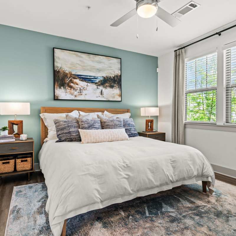 Spacious bedroom with king size bed, large window and ceiling fan at Watersound Origins Crossings in Inlet Beach, Florida
