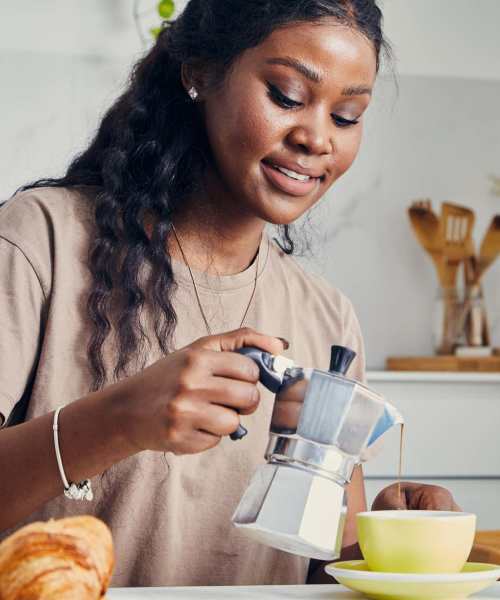 Resident in a spacious kitchen at Fuller's Woods Apartments in Madison, Wisconsin