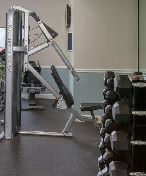 Fitness center showing varous weights at Isles at East Millenia in Orlando, Florida