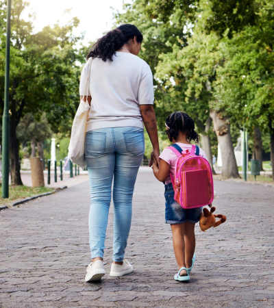 Resident walking her daughter to school near Parish Place in Mount Pleasant, South Carolina