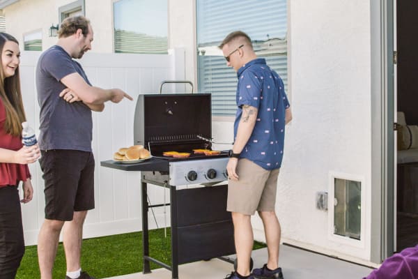 Residents grilling at Christopher Todd Communities On Mountain View in Surprise, Arizona