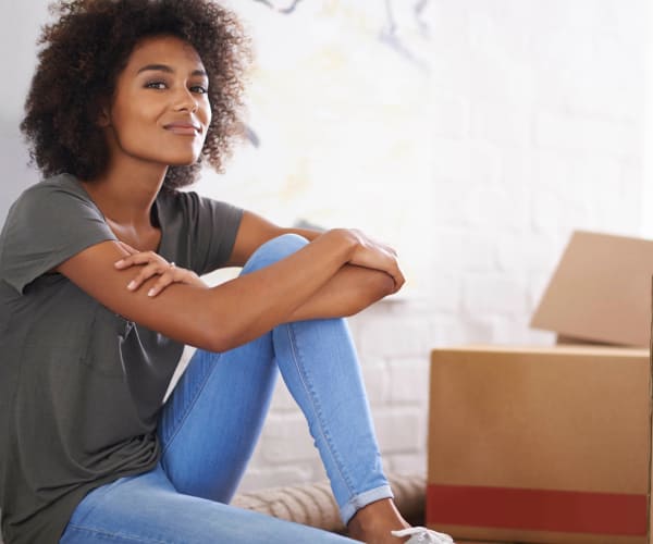 Women with storage boxes at First Rate Storage