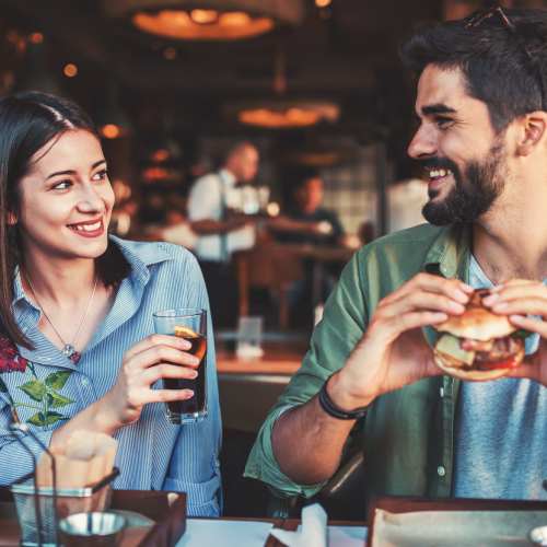 Couple having food at Wasatch Club Apartments in Midvale, Utah