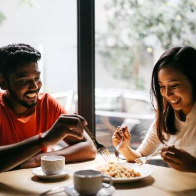Happy couple having a meal in a restaurant near Century Capital City, Tallahassee, Florida