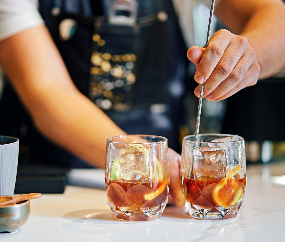 A close-up view of two drinks filled with orange liquid at Ravello 192 in Elkhorn, Nebraska