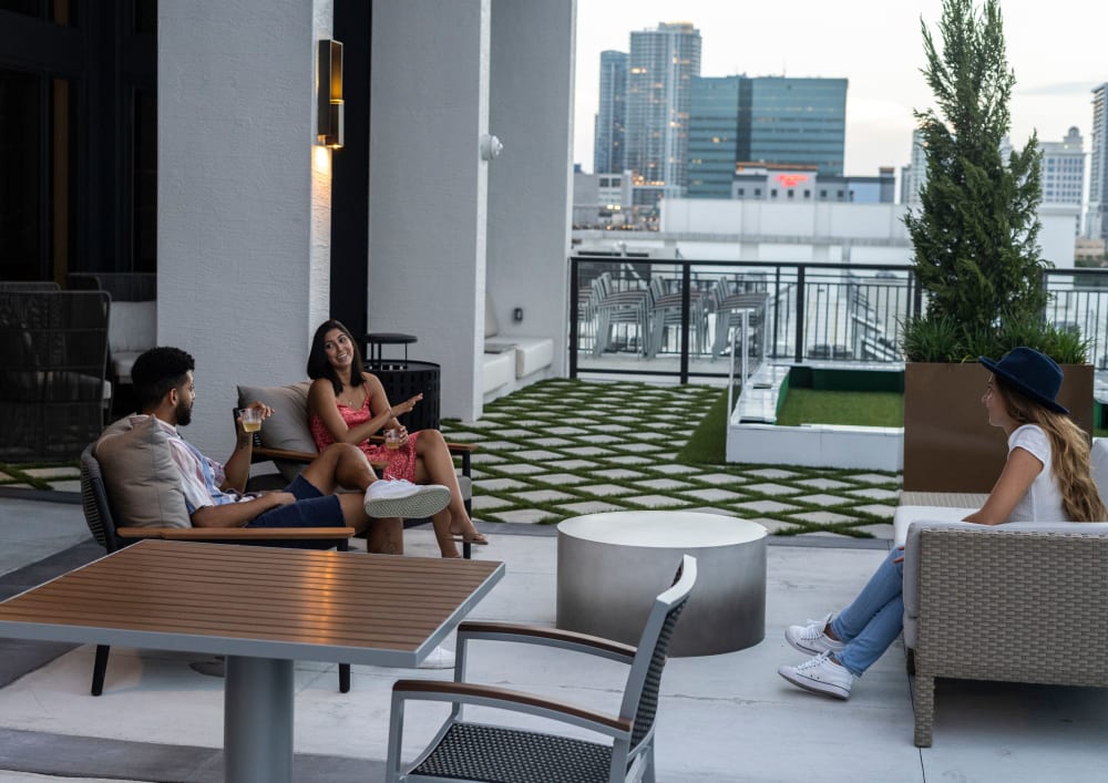Residents relaxing on the terrace lounge at Motif in Fort Lauderdale, Florida