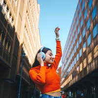 Woman enjoying music in the street near Palisades at Duncan in Duncan, South Carolina