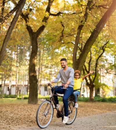 Resident and his kid with a bicycle near The Edison at Peytona in Gallatin, Tennessee