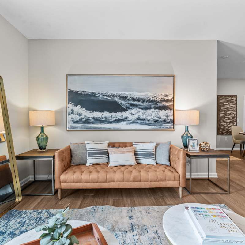 Spacious living room with fancy interiors and designer ceiling fan at North Bay Landing in Panama City, Florida