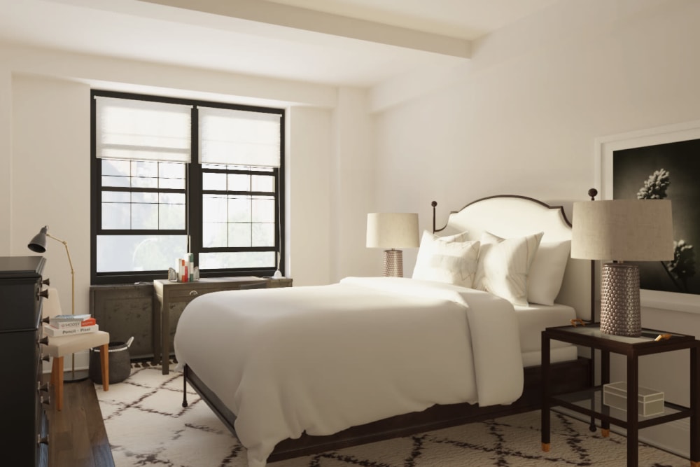 Spacious master bedroom with a large window at London Terrace Gardens in New York, New York