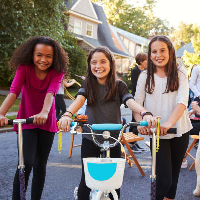 Kids riding scooters and bicycles during a community event at Silver Strand I in Coronado, California