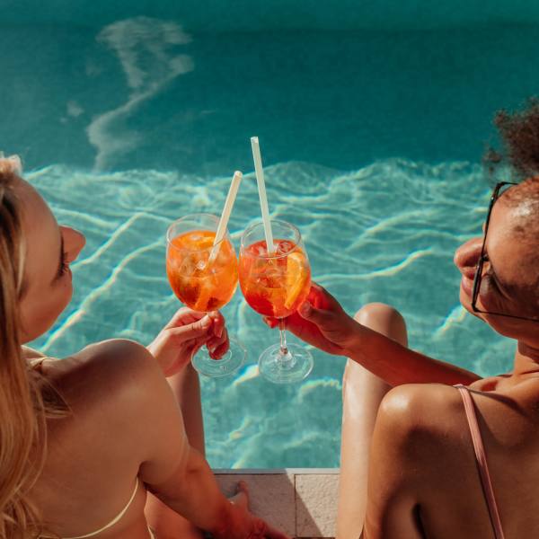 Friends sit poolside at Attain at Towne Place, Chesapeake, Virginia