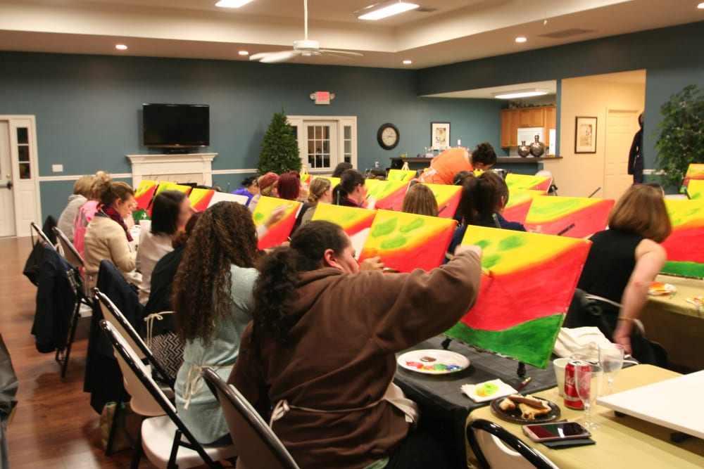 residents at a painting class at United Communities in Joint Base MDL, New Jersey