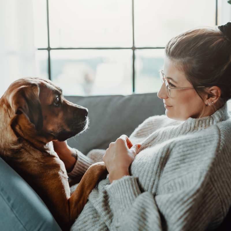 A resident sits with her dog at Attain at Quarterpath, Williamsburg, Virginia