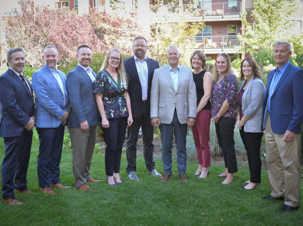 The team gather outside of Touchmark Central Office in Beaverton, Oregon