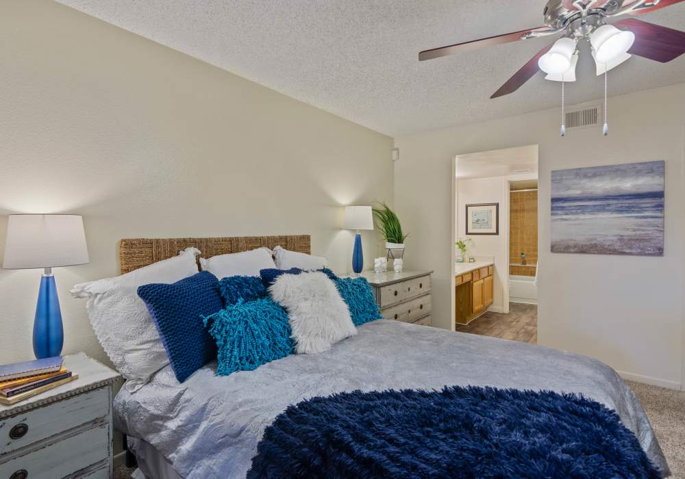 Spacious bedroom with large comfortable bed at Waterford Place Apartments in Mesa, Arizona, 