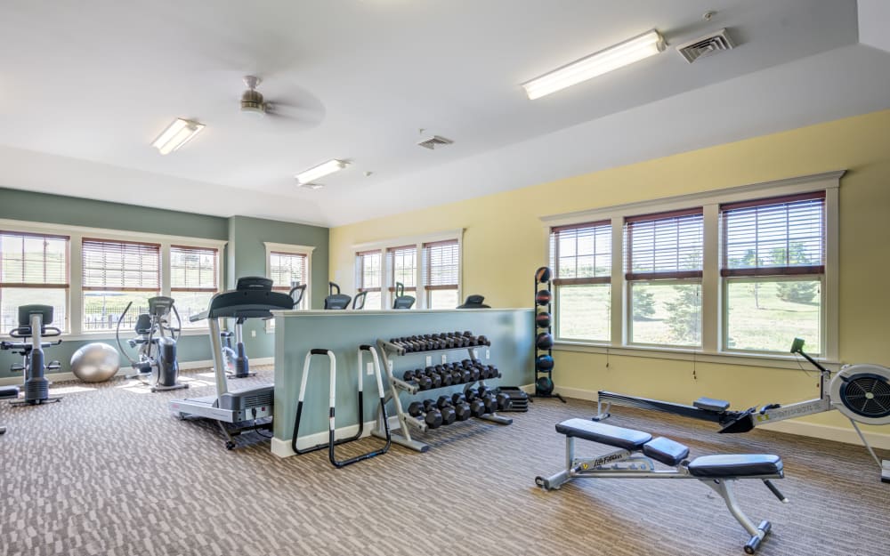 Well-equipped fitness center with cardio equipment at Preserve at Autumn Ridge in Watertown, New York