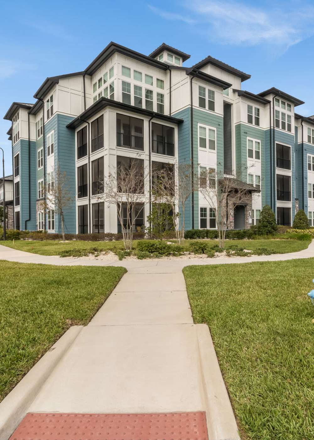 Exterior view of the apartment building at The Addison on Millenia in Orlando, Florida