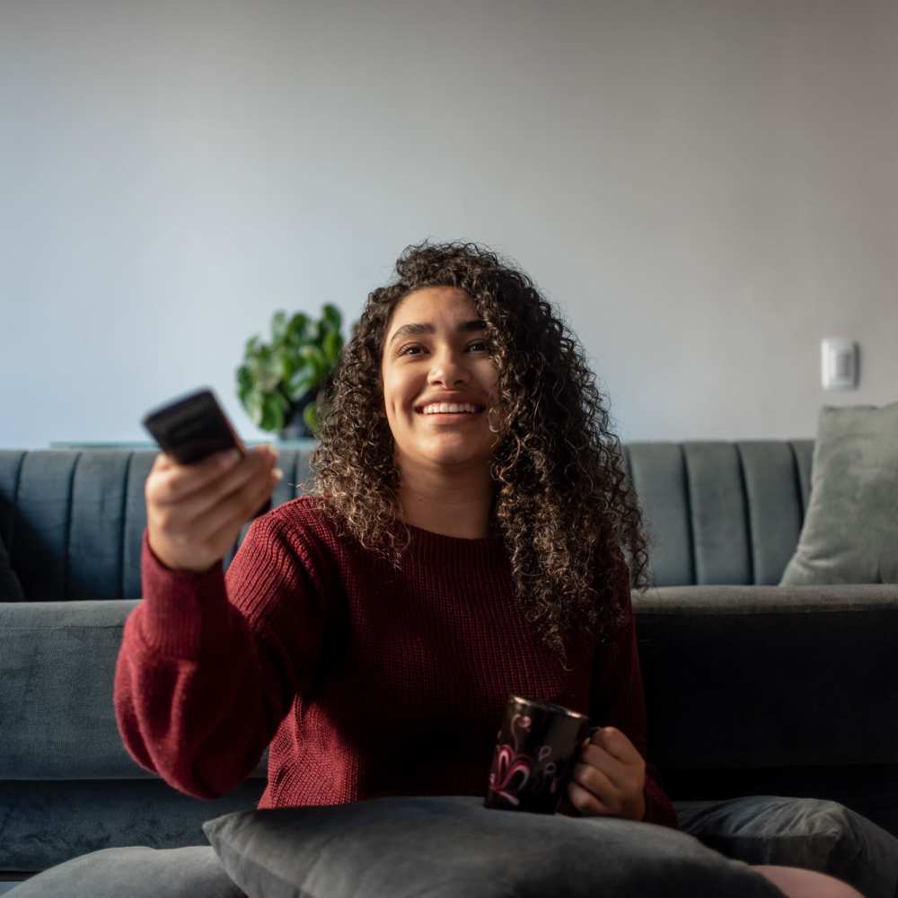 Resident in her living room in an apartment home at Dundalk Village in Dundalk, Maryland