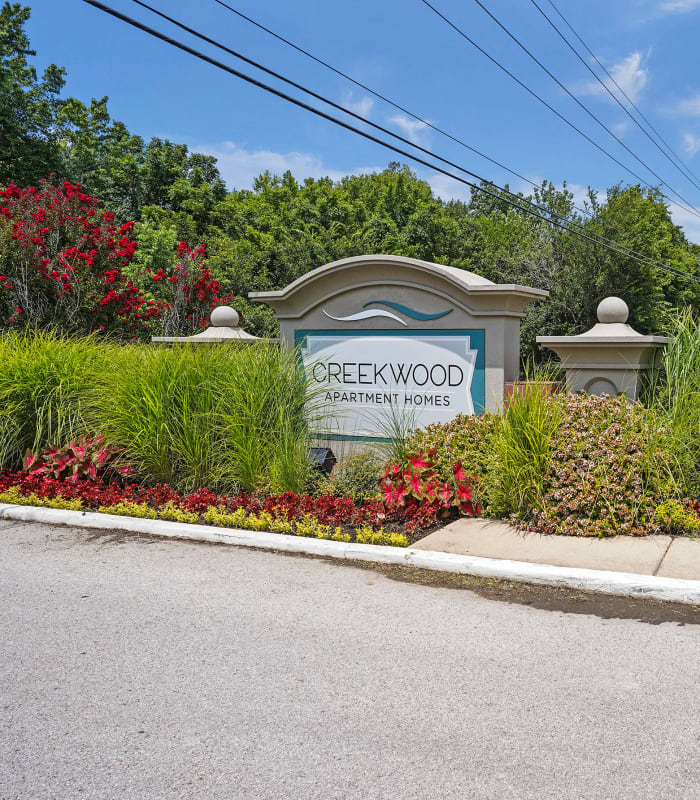 The Exterior with sign at Creekwood Apartments in Tulsa, Oklahoma