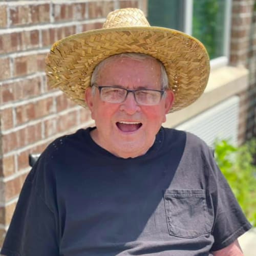 Resident in a hat at Oxford Glen Memory Care at Owasso in Owasso, Oklahoma