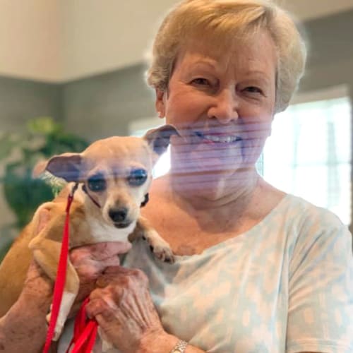 Resident with her dog at Oxford Villa Active Senior Apartments in Wichita, Kansas
