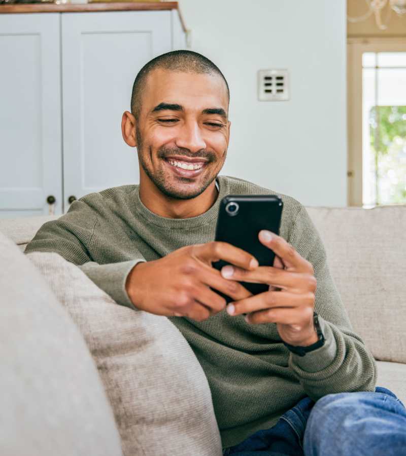A man using his phone to secure a unit lease at CSI Mini Storage Richmond in Richmond, California 