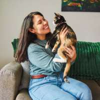 Resident with her cat at Cross Timbers At Grand Street in Amarillo, Texas