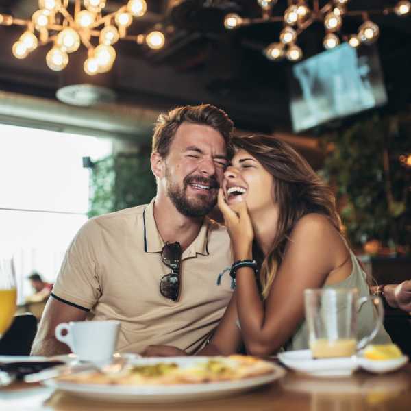Couple having lunch at a restaurant near Laguna Shores Apartments in Corpus Christi, Texas