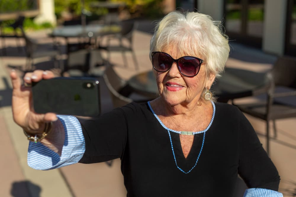 resident taking a selfie at Merrill Gardens at Campbell in Campbell, California