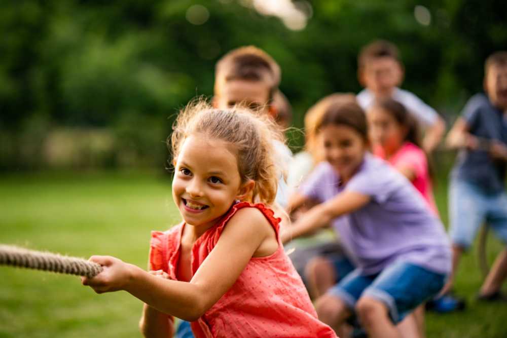 Kids playing tug-of-war at Cypress Point Apartments in Shawnee, Oklahoma