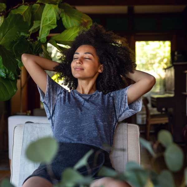 A resident relaxes in her apartment at Arbor Grove, Stafford, Virginia