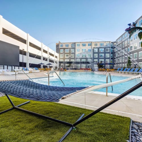 Community pool and hammocks at The Banks Student Living in Coralville, Iowa