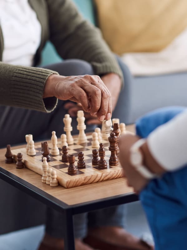 Residents playing chess at English Meadows Conway Campus in Conway, South Carolina