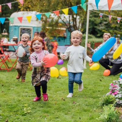 Children playing with balloons at a community event at Midway Manor in Virginia Beach, Virginia