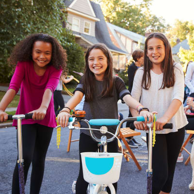 Kids riding on scooters and bicycles during a community event at Coleville in Coleville, California
