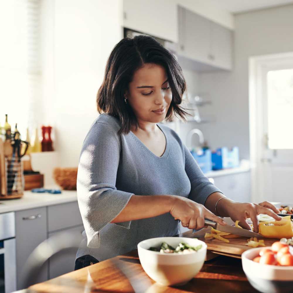 A resident in her apartment kitchen at Ansley Murrayhill in Tigard, Oregon