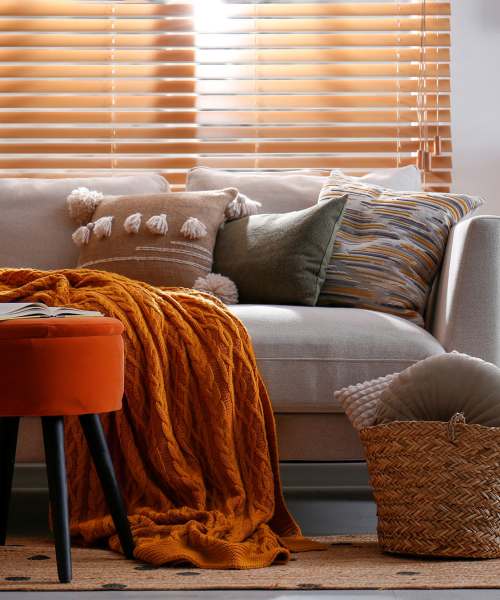 Well-lit, furnished model living room at Copper Steppe in Parker, Colorado